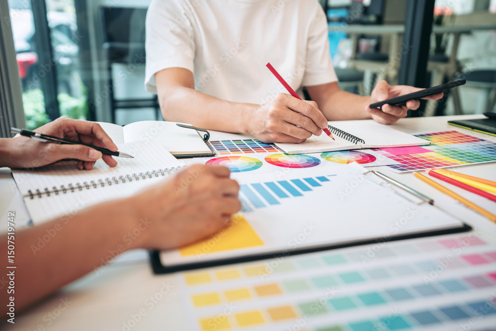 Aufkleber Team of creative graphic designer working on color swatch samples chart for selection coloring in inspiration to create new collection at workplace