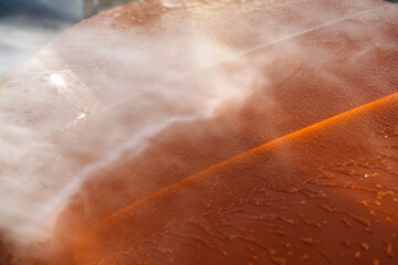 Fototapeta premium Washing car with high pressure power jet wash creating refreshing scene of cleanliness and care