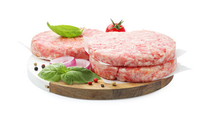 Fresh raw patties for burger, tomato and spices isolated on white