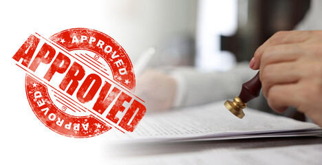 Woman stamping document at table and red stamp Approved, banner design