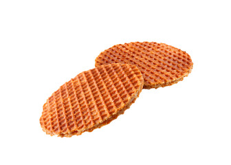 Yummy Dutch waffles (stroopwafels) flying on white background