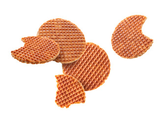 Yummy Dutch waffles (stroopwafels) flying on white background