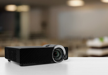 Modern video projector on white table in conference room
