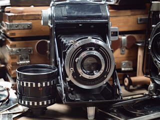 Old cameras in a composition on a wooden background