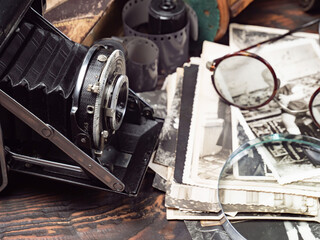 Collection of old cameras, on wooden background.