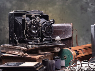 Collection of old cameras, on wooden background.