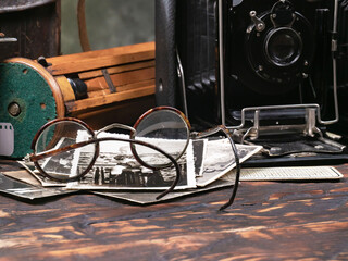 Collection of old cameras, on wooden background.