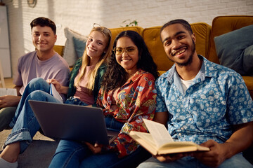 Multiracial group of happy students learning at home.