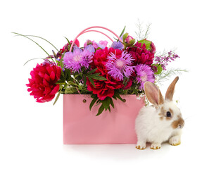 Rabbit and a bouquet of flowers in a basket.