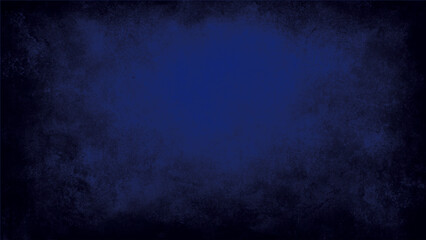 Rustic blue wall background with darker black grungy border and vintage texture design. A beautiful abstract navy blue stucco wall with an old wall pattern texture creating a dark and grungy decorativ