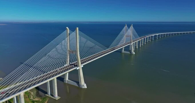 Aerial view of Vasco da Gama bridge crossing the Tagus river in Lisbon, Portugal. Modern design