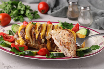 Pork baked with onion and cheese served with vegetables on plate