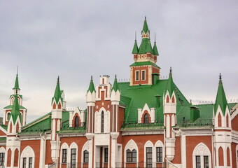 Tiled roof and Gothic towers of pseudo-Gothic architecture