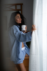 Cozy Morning Vibes with Coffee in Blue Striped Pajamas
