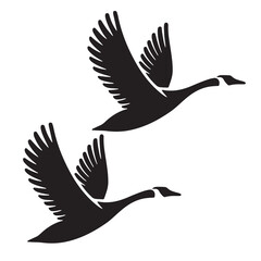 Obraz premium Flying goose silhouette vector illustration with wings spread