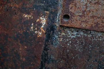 Close-Up of Rusted Iron Plate with Hole, Industrial Texture Background

