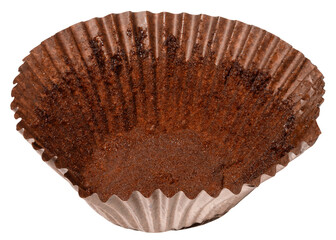 Close up of empty brown paper cupcake or muffin tin with chocolate residue, isolated background