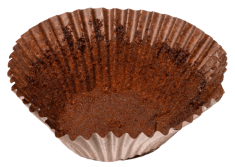 Close up of empty brown paper cupcake or muffin tin with chocolate residue, isolated background