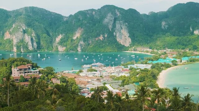Aerial view of tropical island Phi Phi Don with luxury resorts and yachts in bay of Andaman sea, Krabi, Thailand. Popular touristic vacation holiday destination in Asia