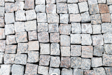 new split stones on cobblestone pavement