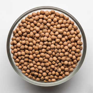 Macro close-up of kulthi (horse gram) in a borosilicate glass bowl, top-view, scattered naturally, white background