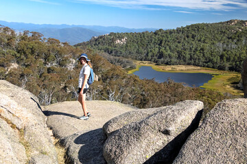 Caucasian Woman Hiking by Lake Catani in Mount Buffalo National Park, Victoria, Australia