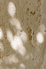 Abstract circular light spots on the stone wall. Blurry Background	