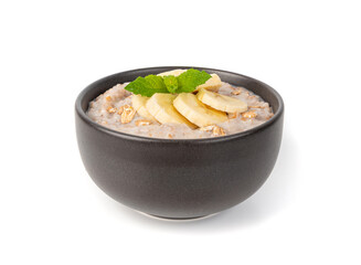 Cooked spelt in bowl isolated. Oatmeal milk porridge with fruits and berries