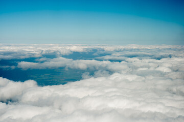 Blue Sky and White Clouds Aerial View for weather or travel context. Useful for backgrounds, presentations, or nature-related projects.