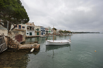 White lla&uuml;t boat floating in portocolom, mallorca, spain