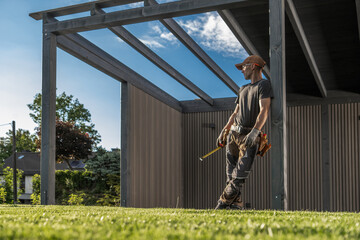 Construction Worker Overseeing Progress at a Site Under a Blue Sky During the Day