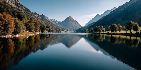 Serene mountain lake reflects alpine scenery