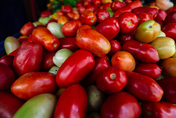 Tomatoes for sale at a street market. Fruit rich in lycopene and contains vitamin C.