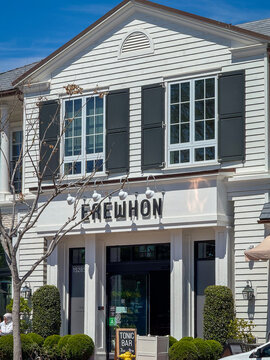 Pacific Palisades, California, USA - April 15, 2024: Facade of Erewhon store on West Sunset Boulevard against blue sky