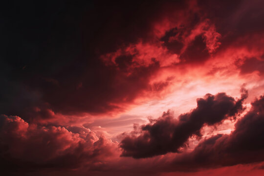 Dramatic Red Sky with Dark Clouds at Sunset or Sunrise creating an intense mood - Powered by Adobe