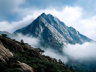 Towering peak shrouded in ethereal mist