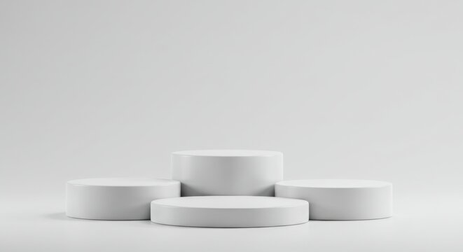 Four white round podiums isolated on white background for product display