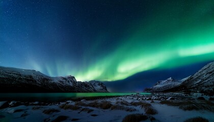 aurora australis or aurora borealis or green northern lights sky above mountains night sky with polar lights night winter landscape with southern lights aurora against real natural black background