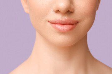 Young woman with beautiful lips on lilac background, closeup