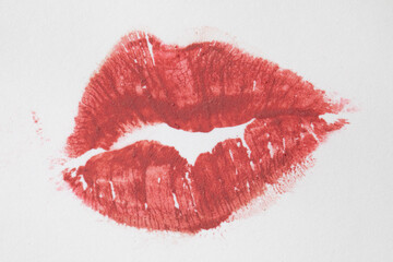 pink-brown lipstick kiss print on white paper