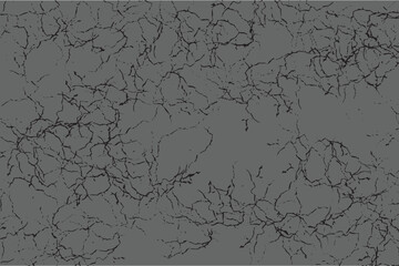 Obraz premium Black cracks covering gray surface creating distressed texture background