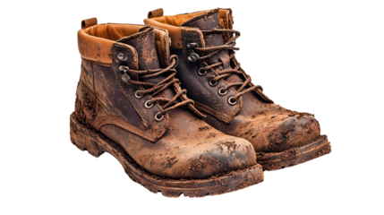 Used, muddy work boots showcasing durability and ruggedness for outdoor activities or labor.