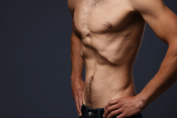 Fototapeta premium Man suffering from anorexia on grey background, closeup. Space for text