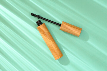 Black mascara on green background
