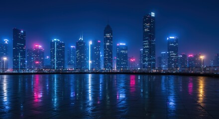 Fototapeta premium City skyline at night with modern architecture and reflections on wet ground in the city