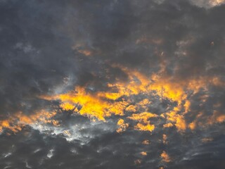 a sky filled with altocumulus clouds with a wavy pattern, creating an interesting texture in the...