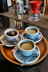 Three cups of coffee on café counter