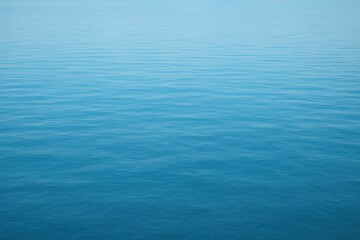 Obraz premium Image of a Calm Body of Water with a Blue Color Creating a Serene Natural Background