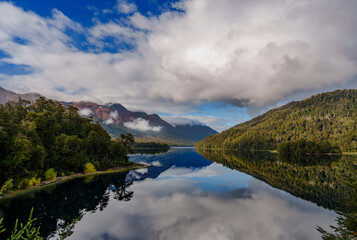 Fototapeta premium Mirror-like reflection of Correntoso Lake on the Seven Lakes Route