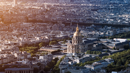 Aerial view of Les Invalides and the surrounding urban landscape in Paris, France, bathed in the warm glow of sunset